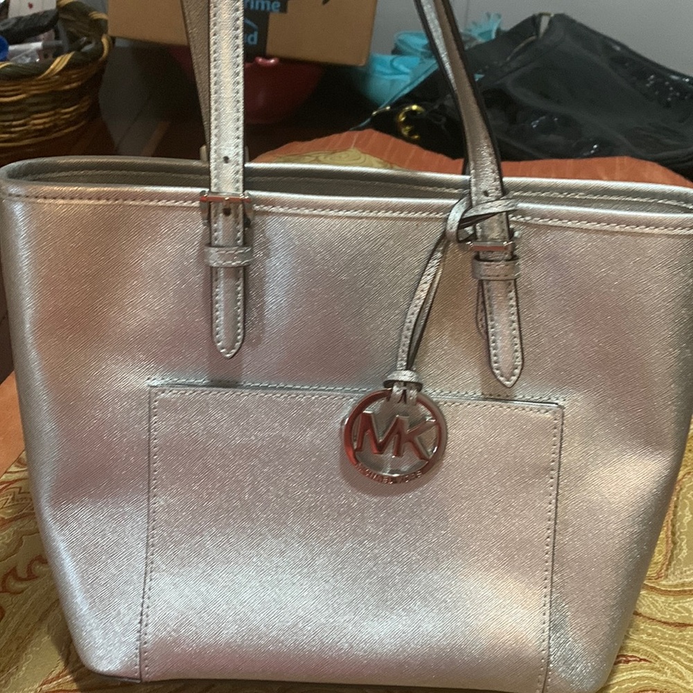 Michael Kors Silver Purse- Divided compartments. Roomie but not overly big!
